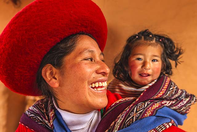 Peruvian woman with her baby in Chinchero village. The Sacred Valley of the Incas or Urubamba Valley is a valley in the Andes  of Peru, close to the Inca capital of Cusco and below the ancient sacred city of Machu Picchu. The valley is generally understood to include everything between Pisac  and Ollantaytambo, parallel to the Urubamba River, or Vilcanota River or Wilcamayu, as this Sacred river is called when passing through the valley. It is fed by numerous rivers which descend through adjoining valleys and gorges, and contains numerous archaeological remains and villages. The valley was appreciated by the Incas due to its special geographical and climatic qualities. It was one of the empire's main points for the extraction of natural wealth, and the best place for maize production in Peru.http://bem.2be.pl/IS/peru_380.jpg